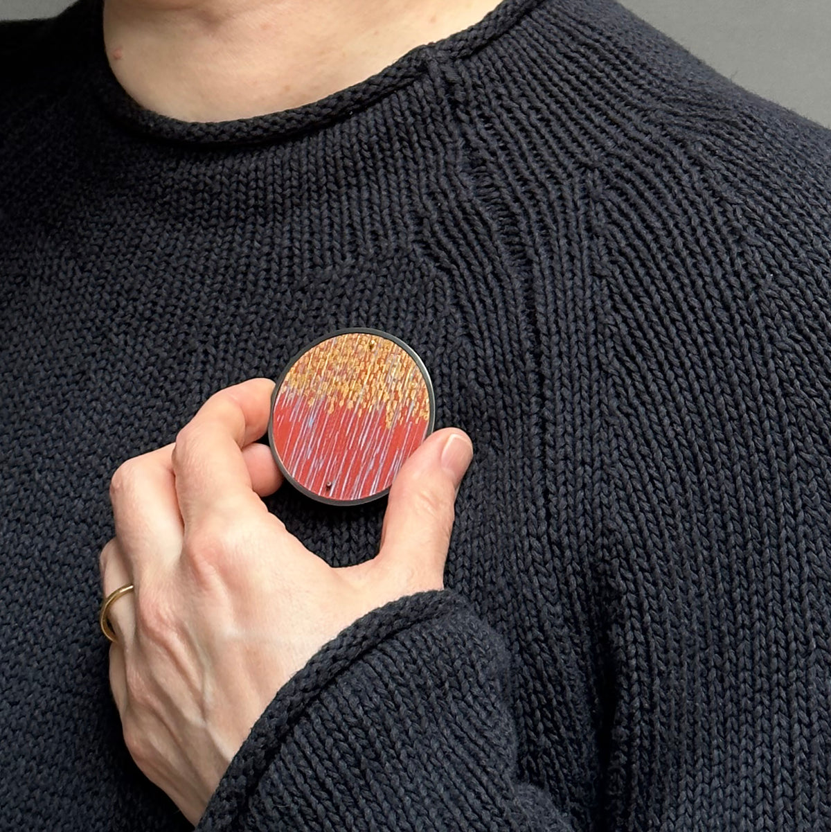 Framed paprika sgraffito brooch