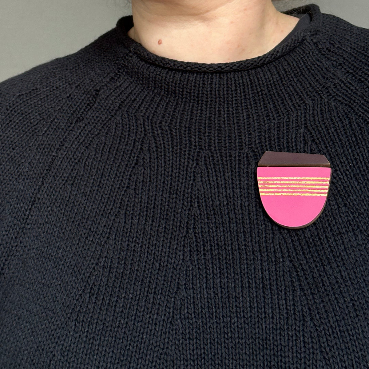 Pink curve brooch