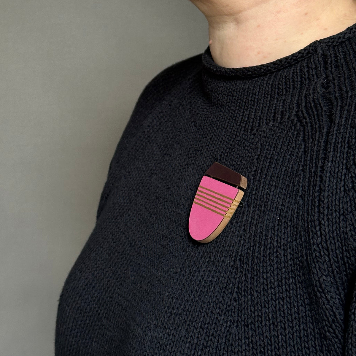Pink curve brooch