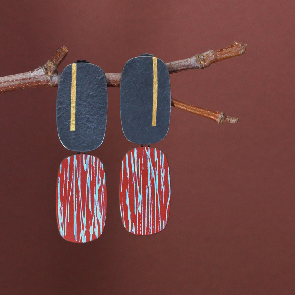 Double oblong earrings in oxidised silver and paprika laminate