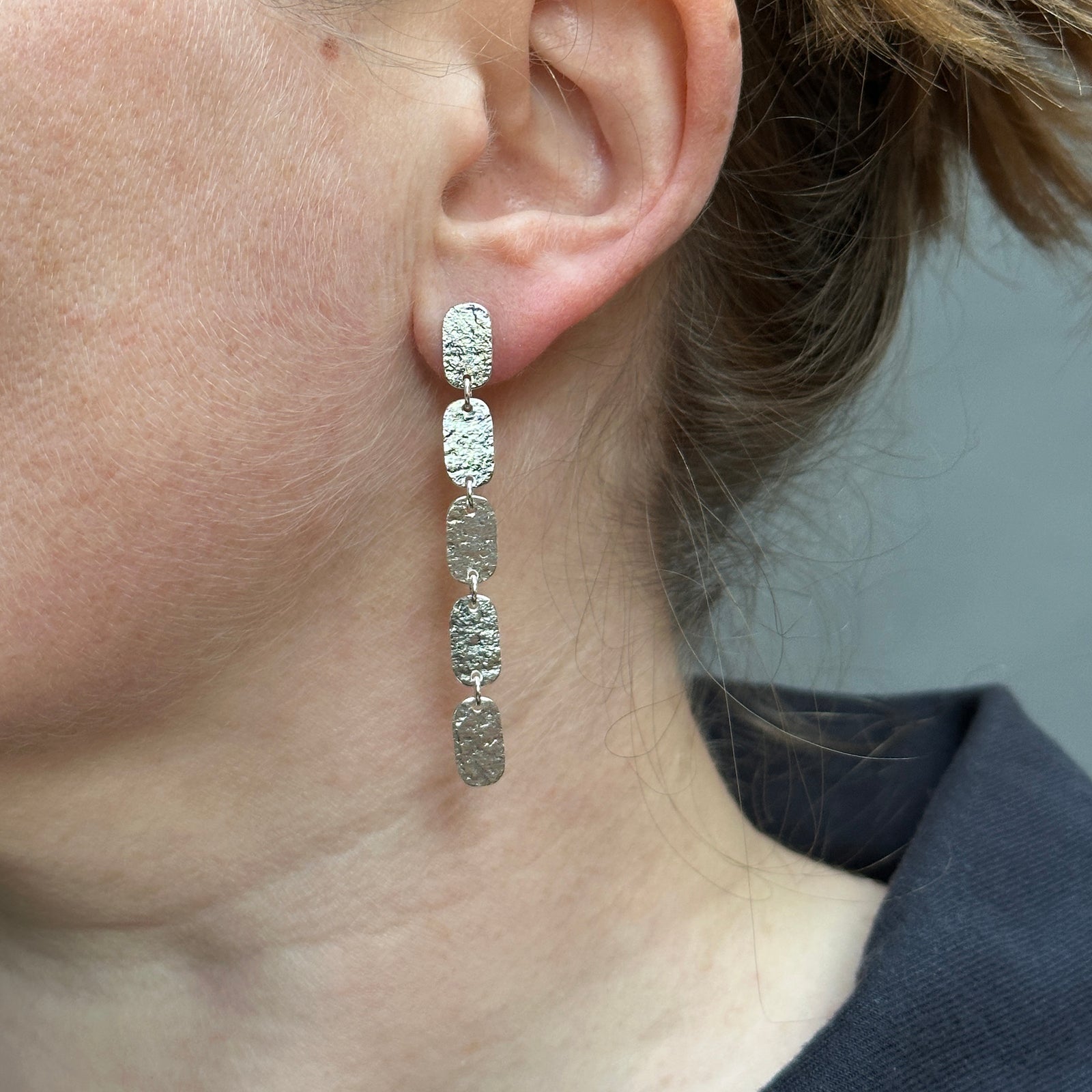 Elegant silver earrings made from five small oblongs.