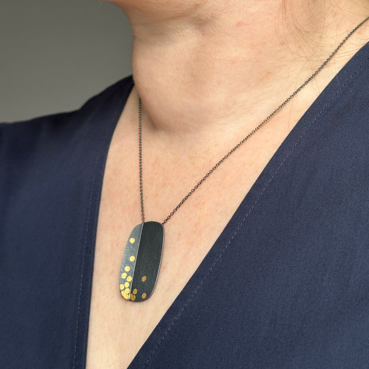 Oblong fold and dot pendant - oxidised silver