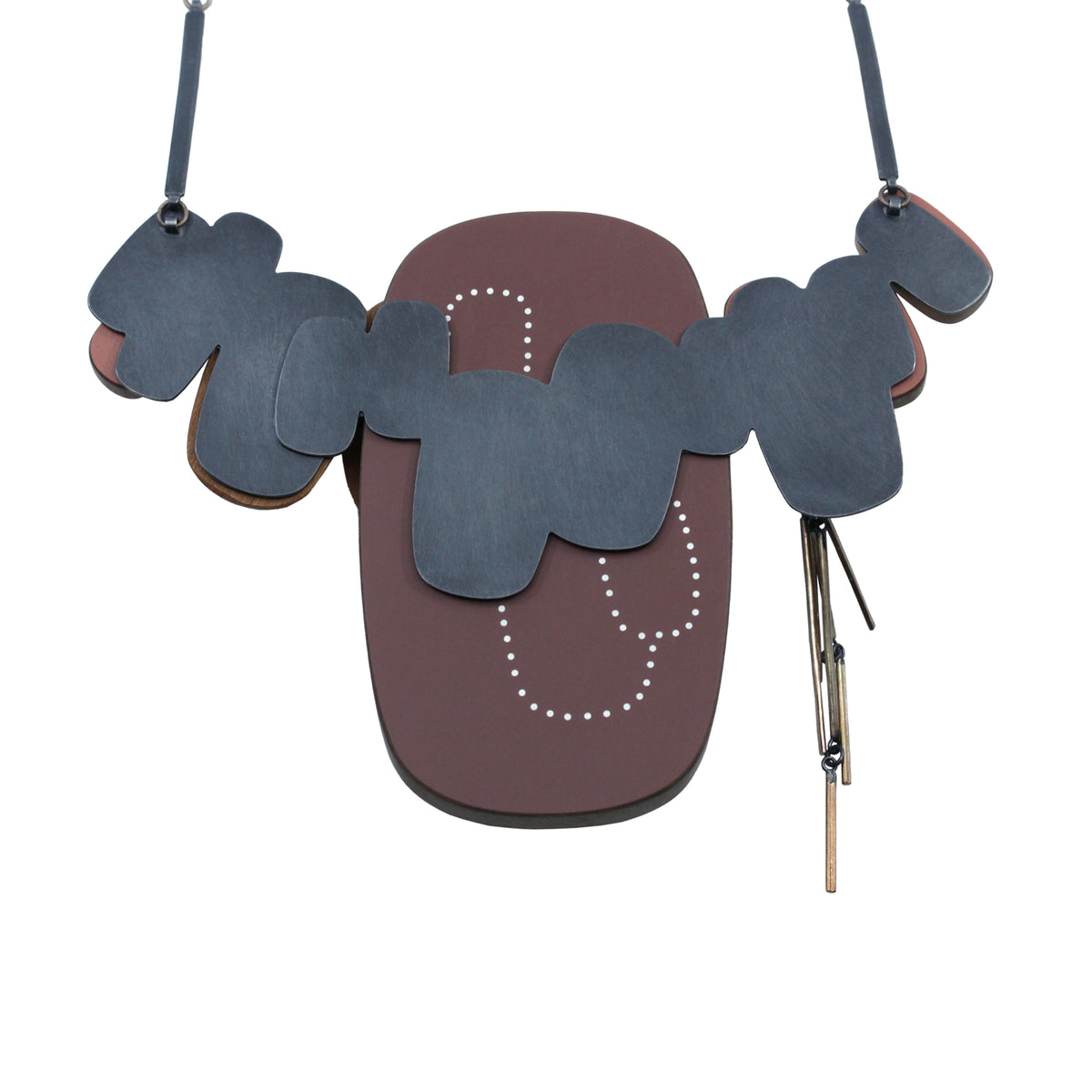 The back of the necklace - brown laminate, oxidised silver and inlaid silver dots